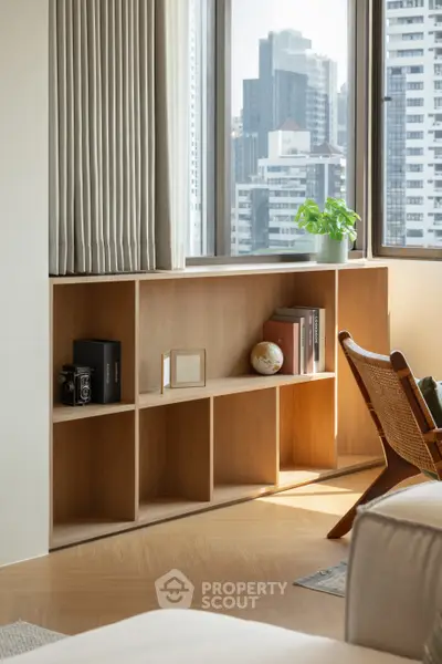 Modern living room with stylish shelving and city view, perfect for urban living.