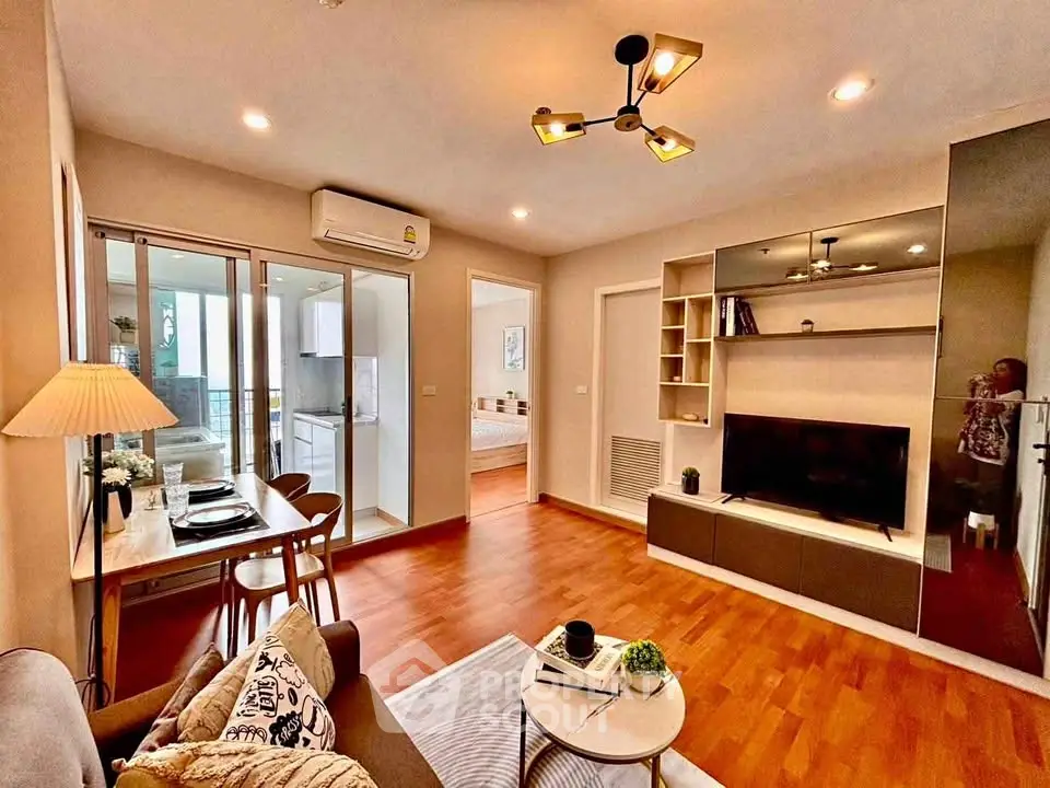 Modern living room with open layout, stylish decor, and natural light, perfect for urban living.