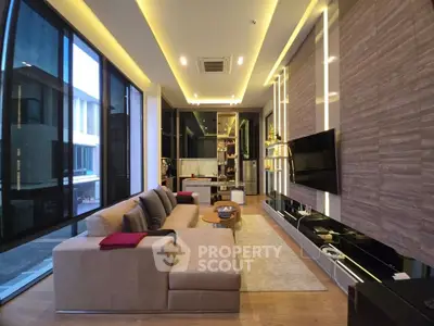 Luxurious modern living room with floor-to-ceiling windows and stylish decor
