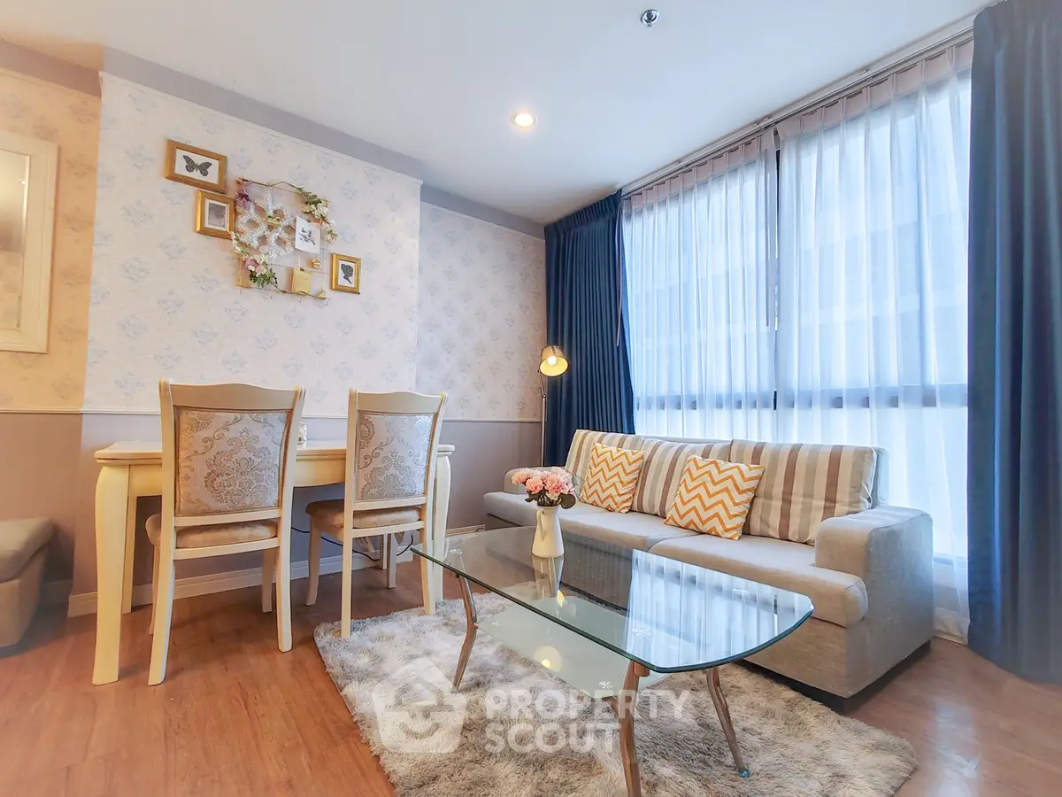 Charming living room with cozy decor and natural light, perfect for relaxation and entertaining.