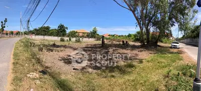Spacious vacant land plot with road access, ideal for development opportunities.