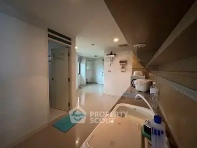 Spacious kitchen with modern appliances and ample storage space