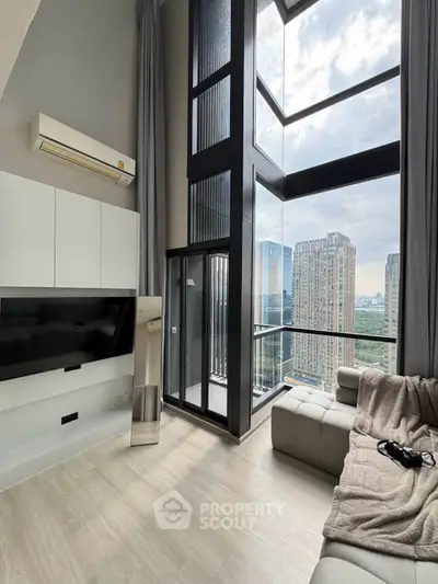Luxurious high-rise living room with floor-to-ceiling windows and stunning city view.