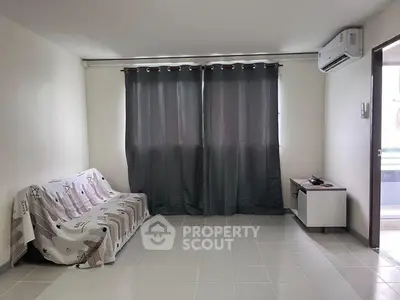 Spacious living room with modern air conditioning and natural light
