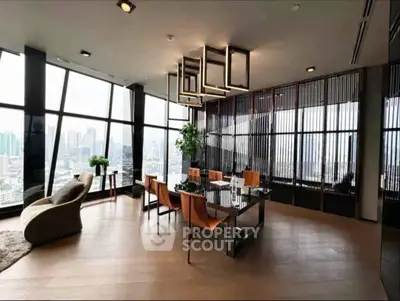Luxurious modern living room with panoramic city views and elegant furnishings.