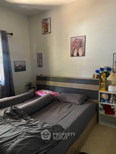 Cozy bedroom with modern decor and stylish wall art