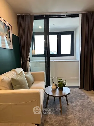 Cozy living room with modern decor and large windows