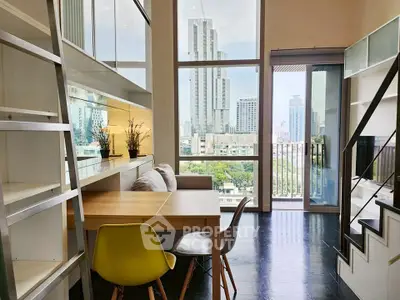 Modern loft apartment with stunning city view and stylish interior design.