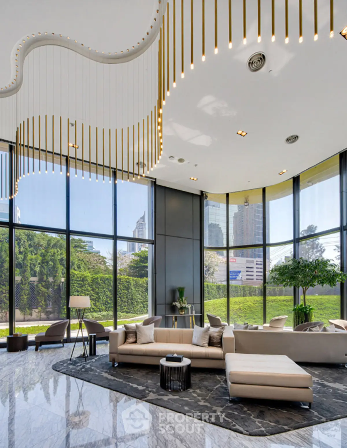 Luxurious modern living room with floor-to-ceiling windows and elegant lighting