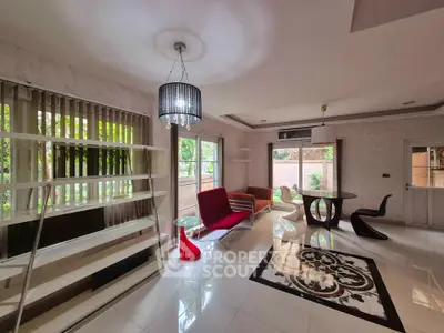 Spacious living room with modern furniture and large windows for natural light.