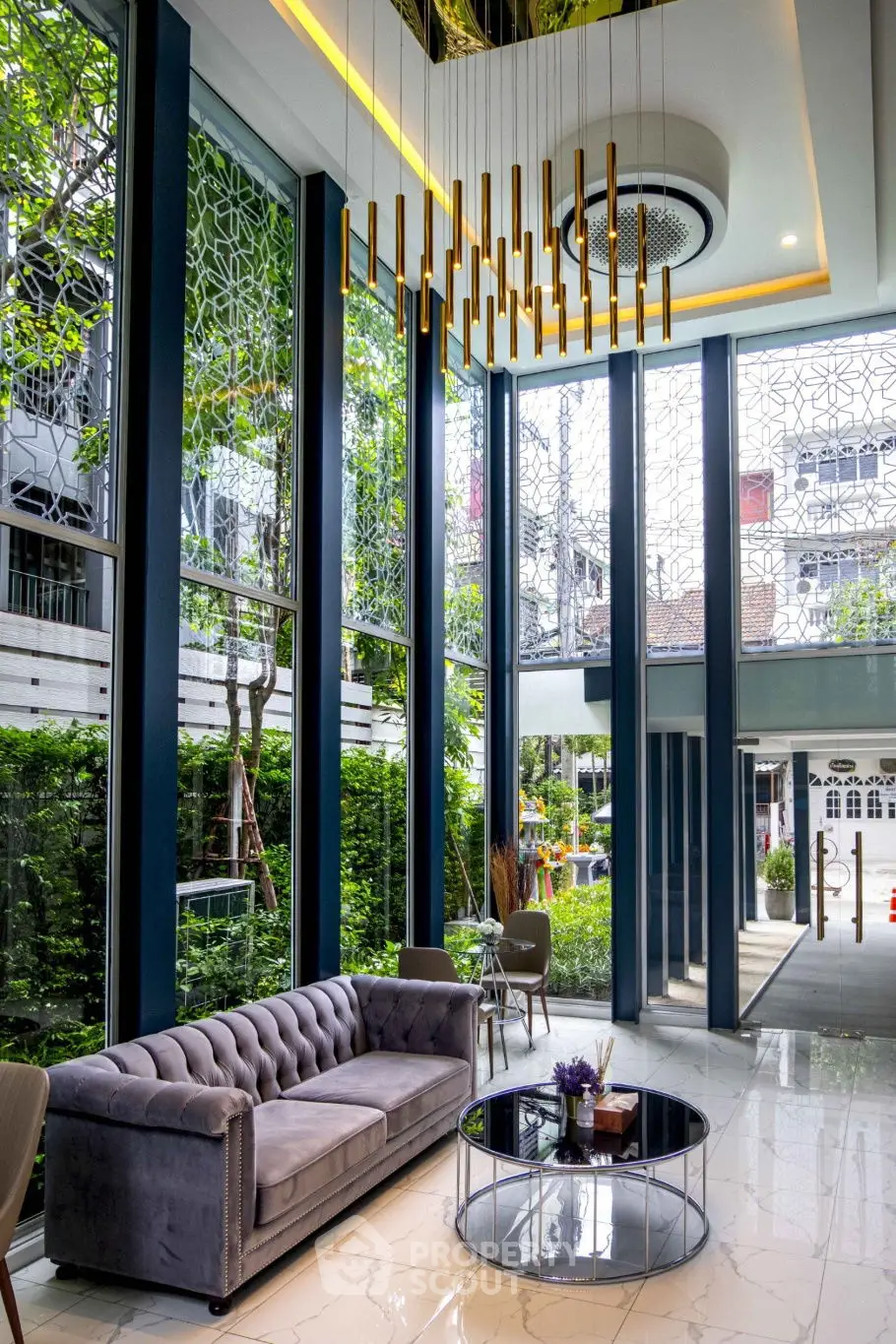 Luxurious modern lobby with high ceilings and elegant chandelier