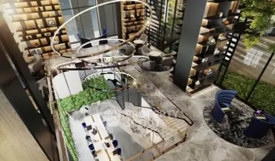 Luxurious modern lobby with stunning spiral staircase and elegant seating area.