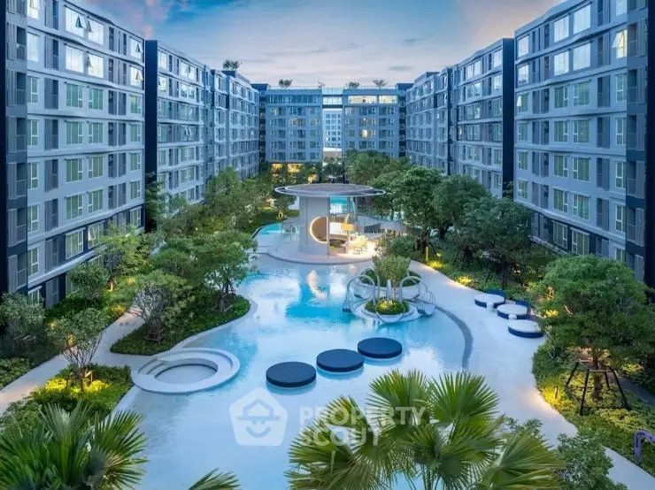 Luxurious modern apartment complex with stunning pool and lush garden view.