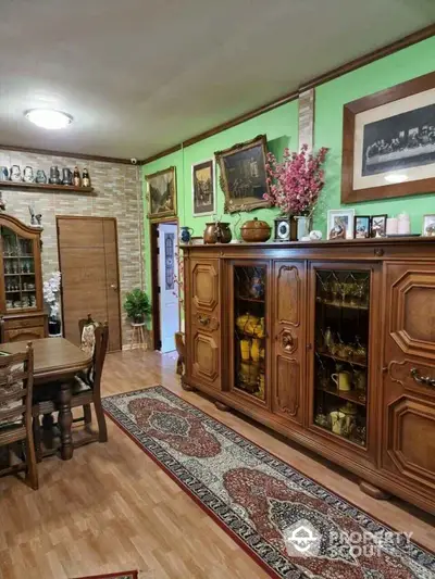 Charming vintage-style living room with wooden furniture and decorative accents.