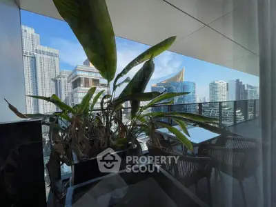 Stunning balcony view with modern cityscape and lush greenery