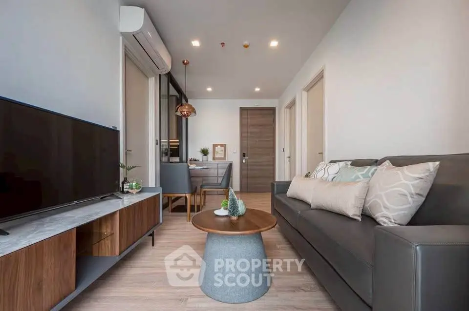 Modern living room with sleek furniture and stylish decor, perfect for urban living.