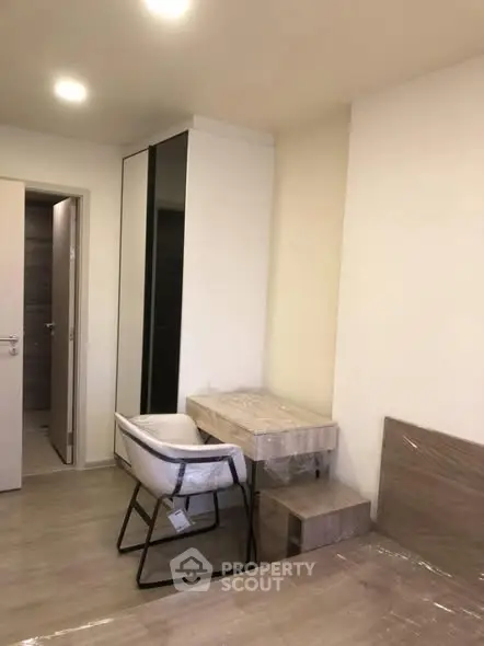 Modern bedroom with sleek furniture and neutral tones