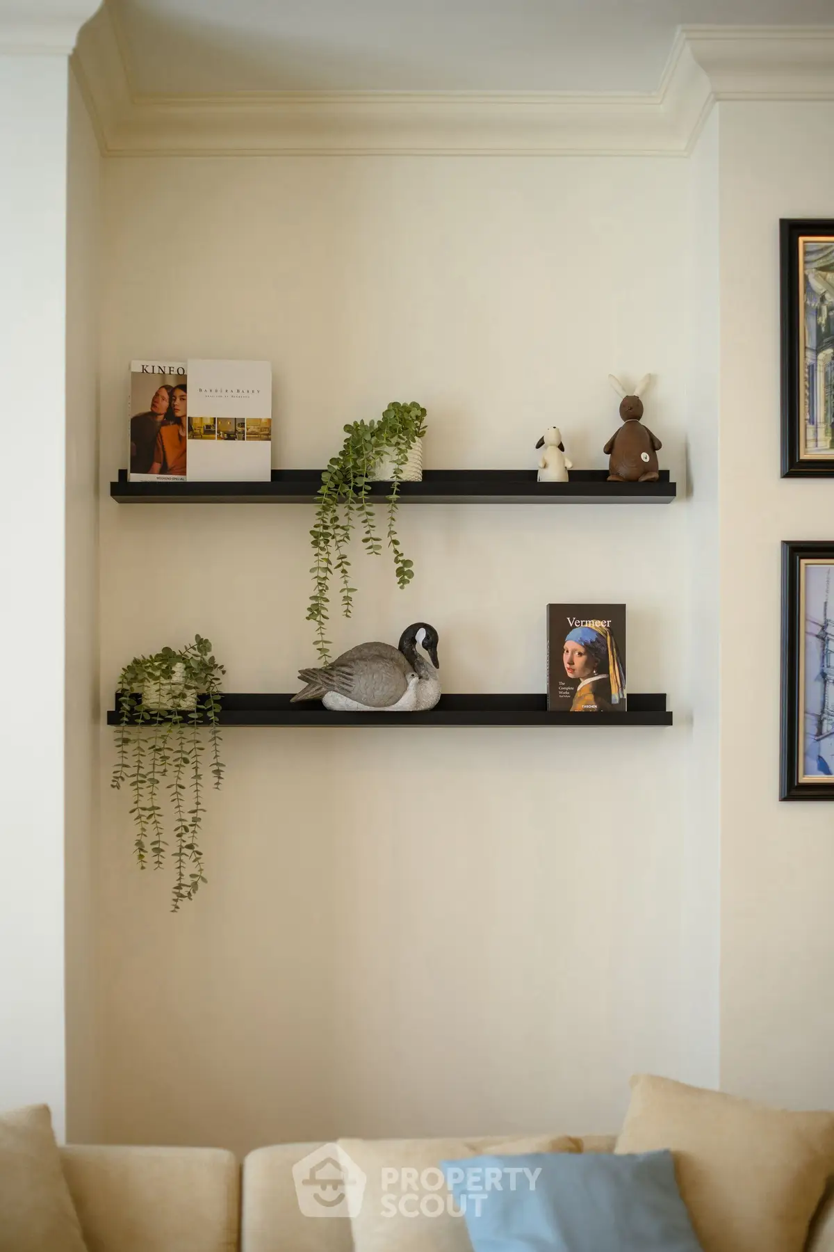 Stylish living room with decorative shelves and cozy sofa, perfect for modern home ambiance.