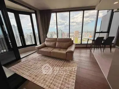 Luxurious living room with panoramic city view and elegant furnishings.