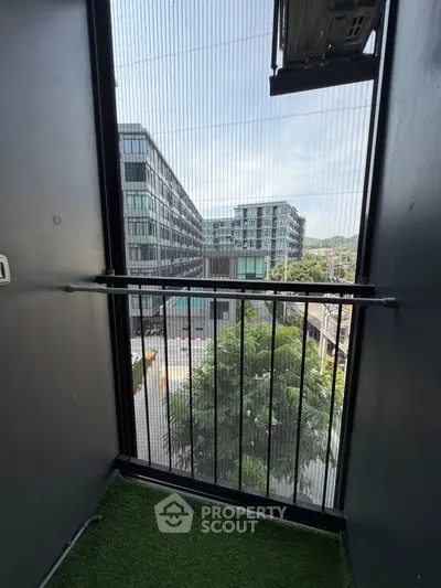 Modern balcony with city view and artificial grass flooring