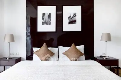Modern bedroom with stylish decor and elegant lighting