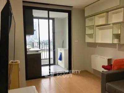 Modern apartment with balcony and stylish shelving, offering a cozy living space with city views.