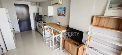 Modern studio apartment with sleek kitchen and cozy living area