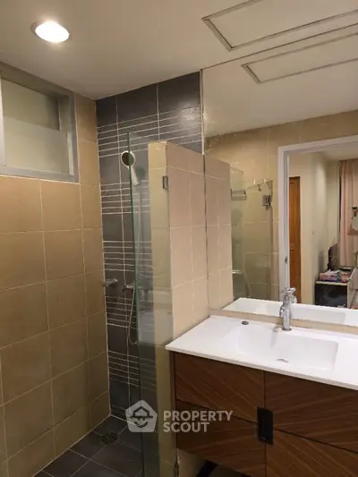 Modern bathroom with sleek design and glass shower enclosure