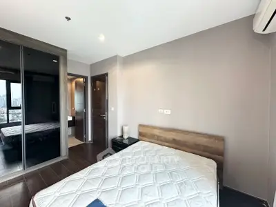 Modern bedroom with sleek design and city view from window