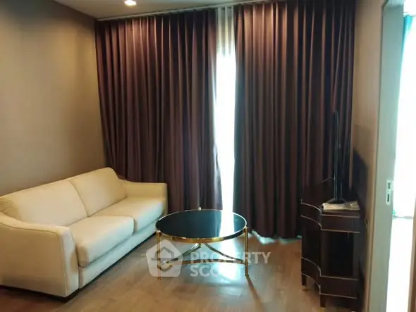Cozy living room with elegant curtains and modern furniture, perfect for relaxation.