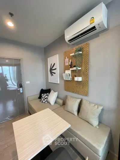 Modern living room with stylish decor and air conditioning unit