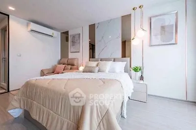 Luxurious modern bedroom with elegant decor and cozy ambiance, featuring stylish lighting and plush bedding.