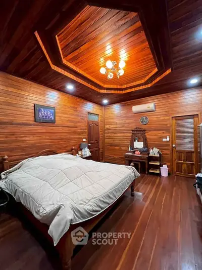 Luxurious wooden bedroom with elegant ceiling design and ambient lighting