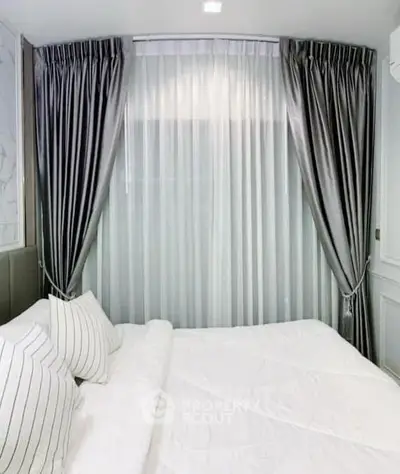 Luxurious bedroom with elegant curtains and plush bedding