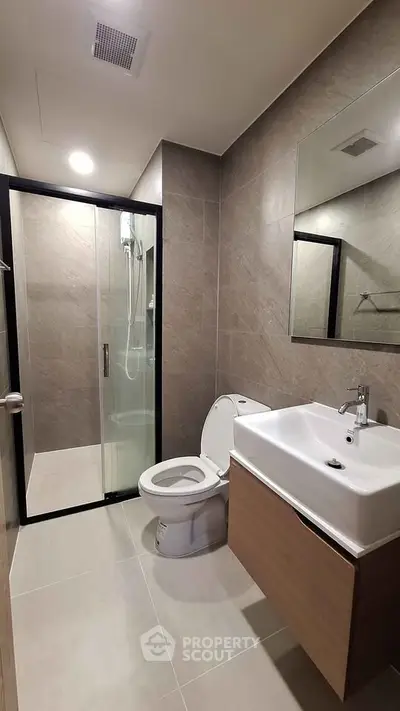 Modern bathroom with sleek shower and contemporary fixtures