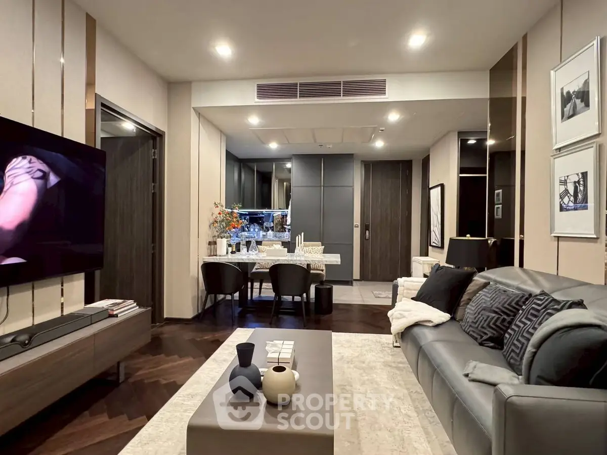 Modern living room with stylish decor and open dining area