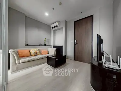 Modern living room with sleek design and cozy sofa in a stylish apartment.