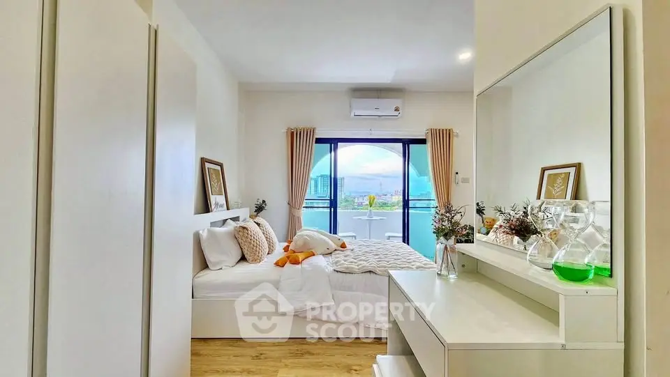 Bright and modern bedroom with balcony view in a stylish apartment