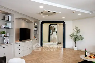 Spacious modern living room with elegant decor and built-in shelving