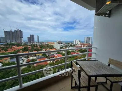 Stunning balcony view with cityscape and ocean horizon, perfect for relaxation and entertaining.