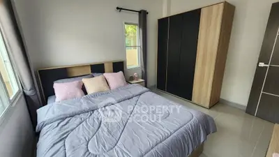 Cozy bedroom with modern wardrobe and stylish bedding