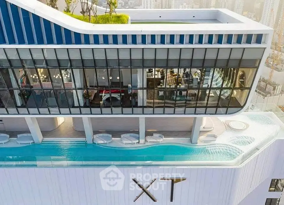 Stunning rooftop pool with panoramic city views in a modern high-rise building.