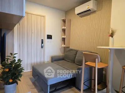 Modern living room with stylish sofa and air conditioning in cozy apartment