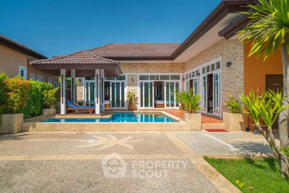 Luxurious villa with private pool and lush garden, perfect for serene living.