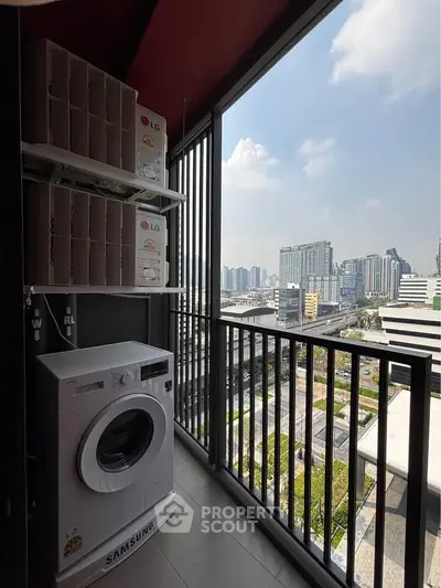 Modern balcony with city view and washing machine, perfect for urban living.