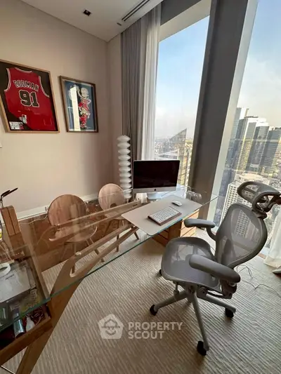 Modern study with glass desk and city view, featuring stylish decor and ergonomic chair.