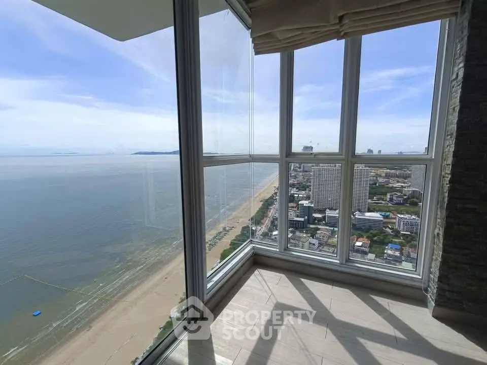 Stunning high-rise corner unit with panoramic ocean and city views.