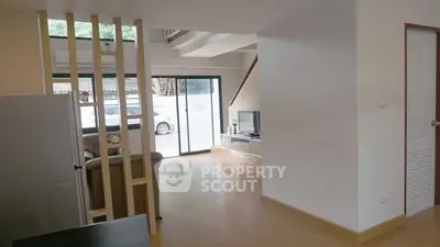 Spacious modern living room with large windows and sleek design