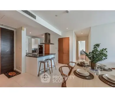 Modern open-plan kitchen and dining area with sleek design and natural light.