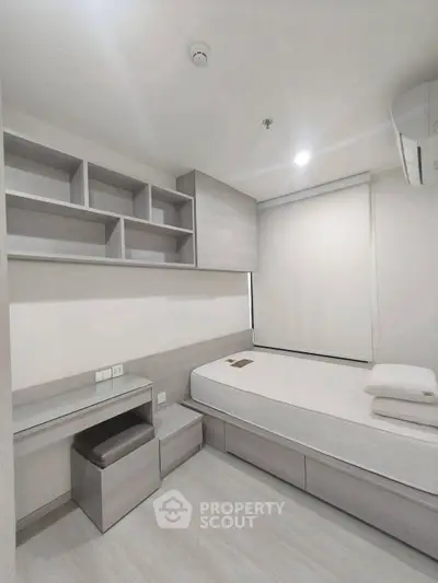 Modern minimalist bedroom with built-in storage and sleek design